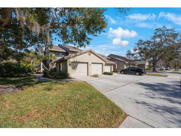 Two-story condo with attached garage and landscaped grounds at 3079 Landmark Blvd # 1606, Palm Harbor, FL 34684