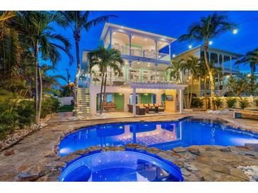 Stunning pool and patio area with a hot tub, perfect for entertaining at 644 Boca Ciega Isle Dr, St Pete Beach, FL 33706