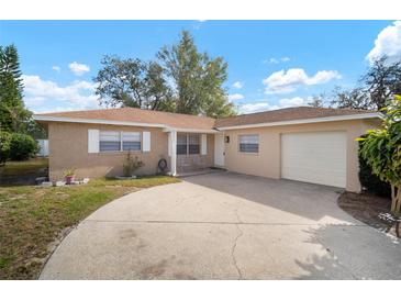Ranch-style home with attached garage and driveway at 1203 Baronwood Pl, Brandon, FL 33510
