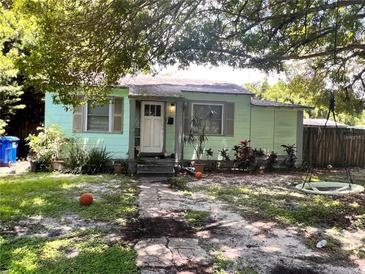 Charming light green house with a well-maintained yard at 1601 Essex N Dr, St Petersburg, FL 33710