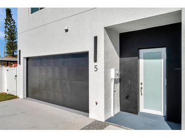 Modern home with attached garage and stylish front door at 2608 W Columbus Dr # 5, Tampa, FL 33607