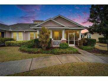 Charming single-story home with front porch and landscaped yard at 302 Latitude Pl, Apollo Beach, FL 33572