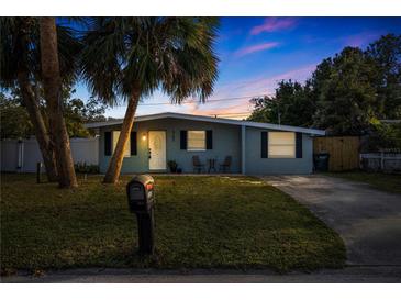 Updated single story home with a landscaped lawn and driveway at 3152 Karen Ave, Largo, FL 33774