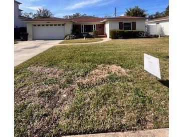 Ranch style home with attached garage and spacious front yard at 3615 S Lightner Dr, Tampa, FL 33629