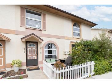 Inviting exterior with a private patio and well-maintained landscaping at 3303 Brigadoon Dr, Clearwater, FL 33759
