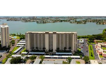 Aerial view of a high-rise building near the water at 7050 Sunset S Dr # 208, South Pasadena, FL 33707