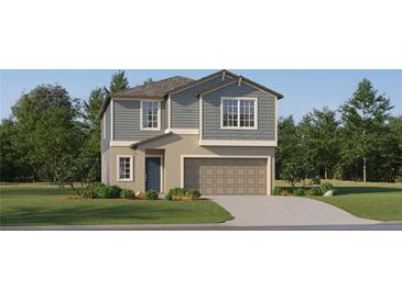 Two-story home with gray siding, beige garage, and landscaping at 8408 Sea Ray Run, Parrish, FL 34219