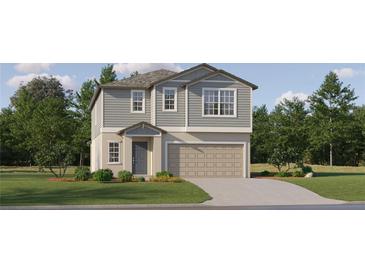 Two-story house with gray siding, two-car garage, and landscaping at 9354 Runaway Breeze Dr, Land O Lakes, FL 34637