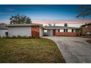 Updated mid-century home with brick accents and a spacious yard at 2124 16Th Sw Ave, Largo, FL 33770