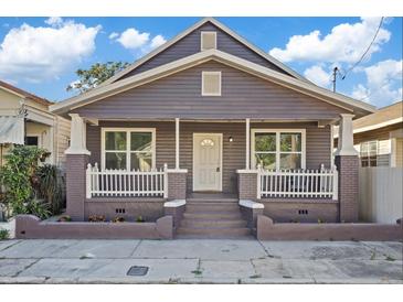 Charming craftsman home with a front porch and well-manicured landscaping at 2912 N 16Th St # 1/2, Tampa, FL 33605