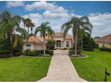 Beautiful one-story home with tile roof and lush landscaping at 34303 Sahalee Loop, Dade City, FL 33525