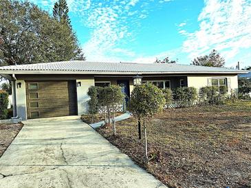 Updated single story home with modern garage door and landscaping at 3843 19Th N Ave, St Petersburg, FL 33713