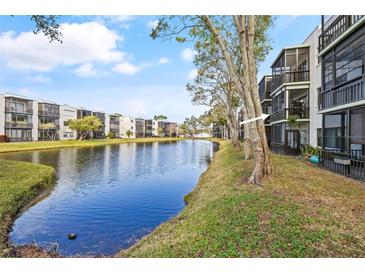 Condo building with water view and landscaping at 5980 Terrace Park N Dr # 203, St Petersburg, FL 33709