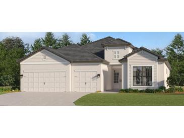 Two-story house with neutral siding, three-car garage, and landscaped lawn at 5609 Lightning Whelk Ln, Lakewood Ranch, FL 34202
