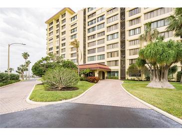 Building exterior showcasing landscaping and entrance at 700 Island Way # 504, Clearwater, FL 33767