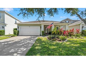 Charming single Gathering home with an attached two-car garage and beautiful landscaping at 11540 Balintore Dr, Riverview, FL 33579