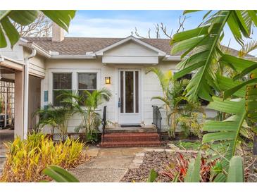 Charming white bungalow with a well-maintained front yard at 17 Venetian Ct, Tarpon Springs, FL 34689