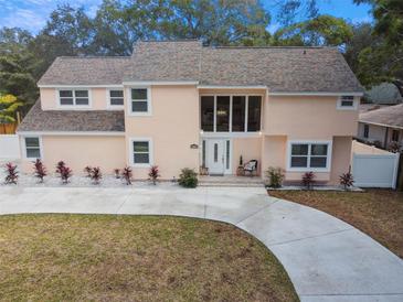 Renovated two-story home with circular driveway and manicured lawn at 2735 Park N St, St Petersburg, FL 33710