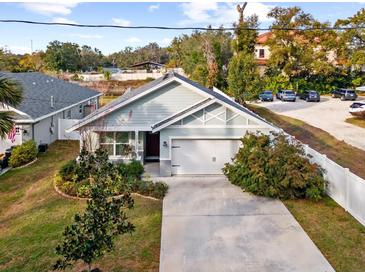 Aerial view of a newly built home with a spacious backyard and driveway at 37137 Florida Ave, Dade City, FL 33525