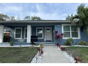 Updated home with a charming front porch and well-manicured landscaping at 4529 11Th S Ave, St Petersburg, FL 33711