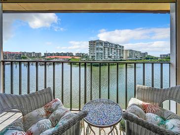 Spacious balcony overlooking waterfront with partial view of marina at 7930 Sun Island S Dr # 305, South Pasadena, FL 33707