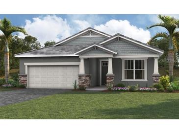 One-story home with gray siding, stone accents, and a two-car garage at 11838 Starbright Path, Venice, FL 34293