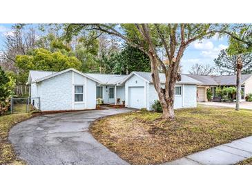 Cute light blue house with a one car garage and small front yard at 3510 Dellefield St, New Port Richey, FL 34655