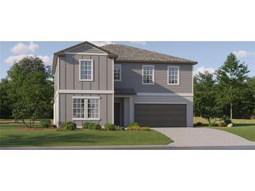 Two-story house with gray siding, brown garage door, and landscaping at 3632 Forest Path Dr, Plant City, FL 33565