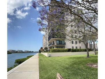 Waterfront condo building with landscaped grounds and parking at 7600 Sun Island S Dr # 804, South Pasadena, FL 33707