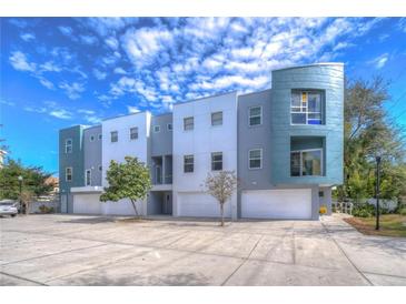 Modern townhouses with attached garages and ample parking at 3405 W Swann Ave # 1, Tampa, FL 33609