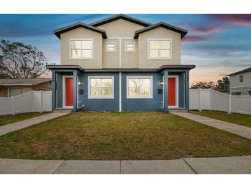 Modern two-story duplex with red doors and blue siding at 3469 17Th S Ave, St Petersburg, FL 33711