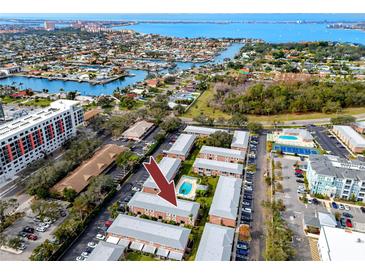 Aerial view of condo community showing building location, pool, and tennis court at 3475 41St S Ter # 215, St Petersburg, FL 33711