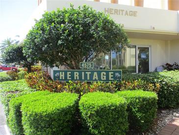 Heritage condominium building signage with landscaping at 4575 Cove Cir # 904, Madeira Beach, FL 33708