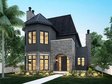 Elegant two-story home with stone accents and a metal roof at 807 W Park Ave, Tampa, FL 33602