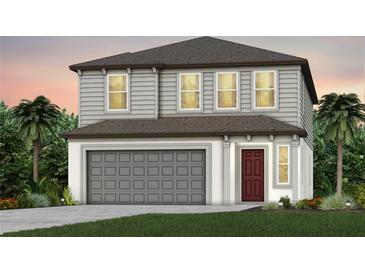 Two-story house with gray siding, brown roof, and a two-car garage at 9801 Crescent Moon Dr, Riverview, FL 33578