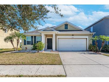 One-story house with a two-car garage and well-maintained lawn at 11536 Tangle Stone Dr, Gibsonton, FL 33534