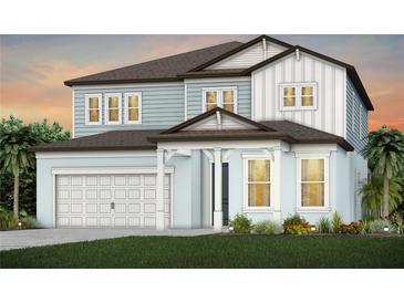 Beautiful two-story home with a two-car garage and light blue accents at 12656 Glenn Creek Dr, Riverview, FL 33569