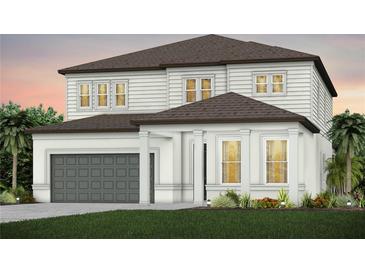 Two-story home with gray roof and garage at 12660 Glenn Creek Dr, Riverview, FL 33569