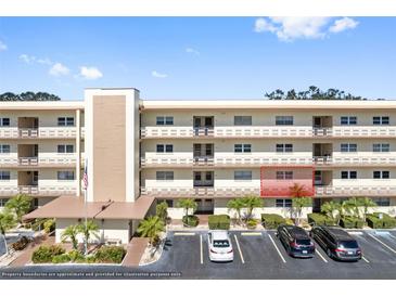 Two-story condo building with ample parking at 5705 80Th N St # 210, St Petersburg, FL 33709