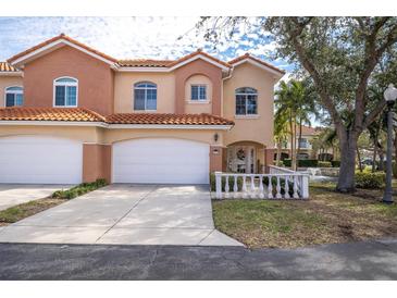 Two-story townhome with double garage and landscaped front yard at 6224 Vista Verde W Dr, St Petersburg, FL 33707