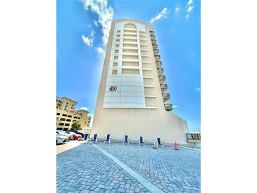 High-rise building with ocean views and chairs at 450 S Gulfview Blvd # 408, Clearwater Beach, FL 33767