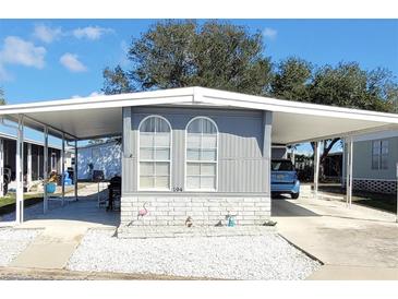 Charming single-story home with a carport and well-kept landscaping in a serene community at 9790 66Th N St # 194, Pinellas Park, FL 33782