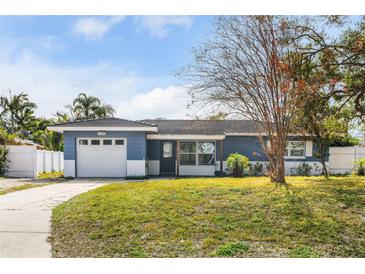 Charming ranch home with a two-car garage and well-manicured lawn at 11320 114Th Ave, Largo, FL 33778