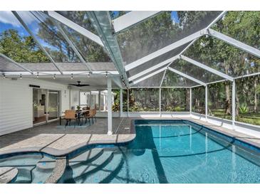 Inviting pool area with a screened enclosure and patio at 11624 Monette Rd, Riverview, FL 33569