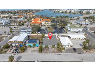 Aerial view showing a single-Gathering home and surrounding buildings at 117 73Rd Ave, St Pete Beach, FL 33706