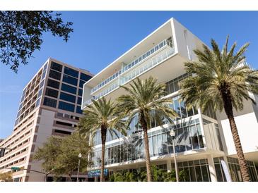 Modern building featuring sleek lines, floor-to-ceiling windows, and palm trees enhancing its contemporary design at 145 2Nd S Ave # 616, St Petersburg, FL 33701