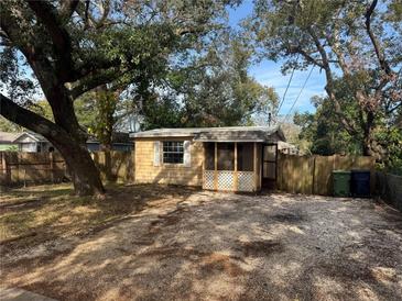 Cute bungalow with screened porch and large yard at 2008 E Annie St, Tampa, FL 33612