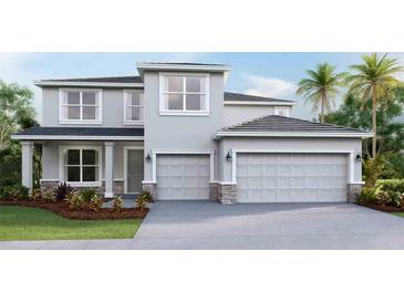 Two-story house with gray siding, stone accents, and a three-car garage at 4330 Pullet Ct, Bradenton, FL 34211