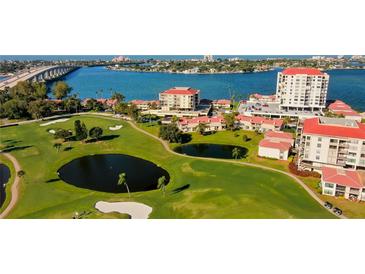 Aerial view of waterfront community with golf course, pool, and condos at 6265 Sun Blvd # 906, St Petersburg, FL 33715