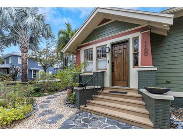 Charming craftsman home with a landscaped front yard and walkway at 1100 3Rd N St, St Petersburg, FL 33701